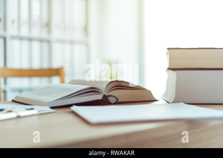 Open book on desk in law firm office, selective focus Stock Photo