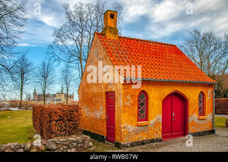 A small house on the courtyard grounds of the church of Saint Mary in the old town of Helsingor in Denmark. Stock Photo