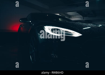 In this Image you´ll find a nice Tesla Model S in a underground parking area. Stock Photo