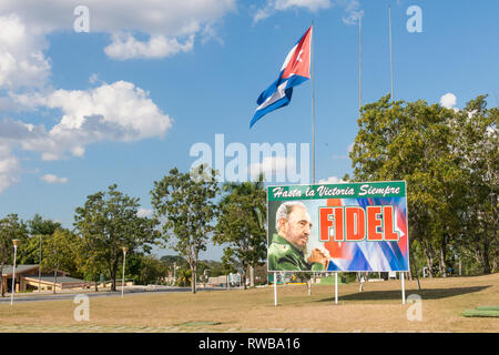 SANTA CLARA, CUBA-JANUARY 6, 2017: Poster with image of Fidel Castro and Cuban flag in the Revolution square in the city of Santa Clara, Cuba. Next is Stock Photo