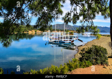 Gulet moored in beautiful bay, Gulet Boat Cruise, Mediterrean Sea, Turkey Stock Photo