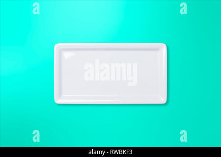 Empty white cornered plate on teal gradient background, view directly from above Stock Photo