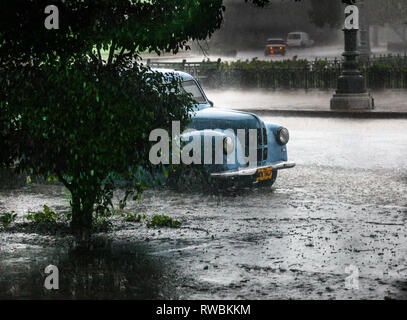 Havana, Cuba. 28th May, 2009. A four door Ford Prefect parked on a street during a thunderstorm in Havana, Cuba. Stock Photo