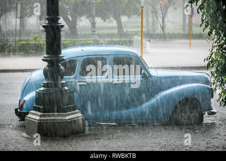 Havana, Cuba. 28th May, 2009. A four door Ford Prefect parked on a street during a thunderstorm in Havana, Cuba. Stock Photo