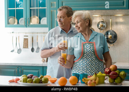 Elderly couple drinking fresh juice Stock Photo