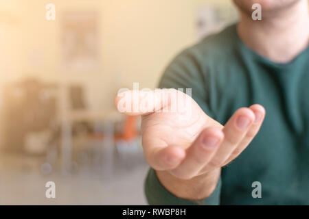 Businessman Extending Hand, Selective Focus and Shallow Depth of Field. Stock Photo