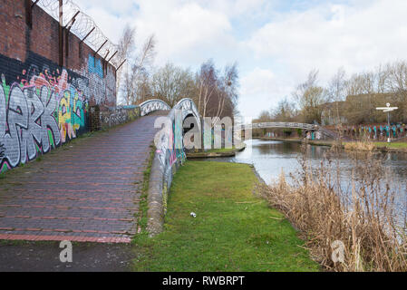 The Birmingham Canal Old Line running through the Birmingham inner city district of Ladywood which is undergoing regeneration Stock Photo