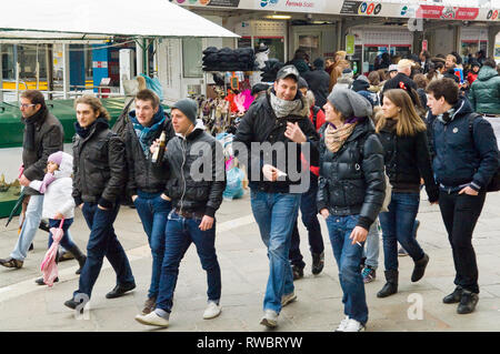 Groups of people walking around during carnival weekend in Venice, Italy Stock Photo