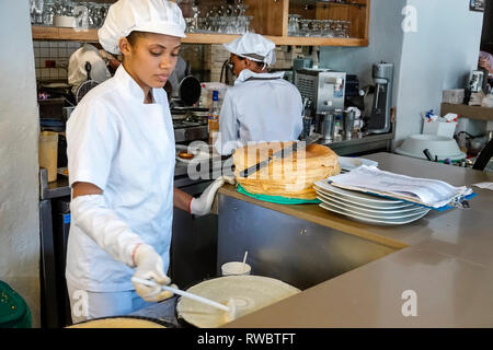 Cartagena Colombia,Crepes & Waffles,restaurant restaurants food dining cafe cafes,inside interior,open kitchen,crepe maker chef,Black African Africans Stock Photo