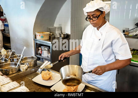 Cartagena Colombia,Crepes & Waffles,restaurant restaurants food dining eating out cafe cafes bistro,inside interior,kitchen,Black Blacks African Afric Stock Photo
