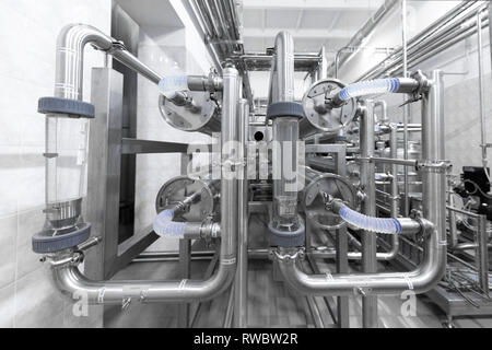 Chrome pipes close-up. Industrial background Stock Photo