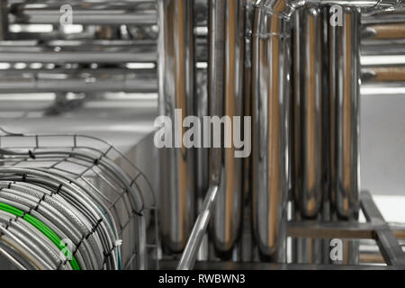 bright wires and chrome pipes. industrial background Stock Photo