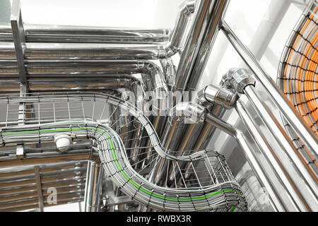 bright wires and chrome pipes. industrial background Stock Photo