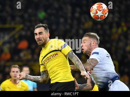 Dortmund, Germany. 05th Mar, 2019. Borussia Dortmund's Paco Alcacer (L) and Tottenham Hotspur's Toby Alderweireld battle for the ball during the UEFA Champions League round of 16 second leg soccer match between Borussia Dortmund and Tottenham Hotspur at Signal Iduna Park. Credit: Bernd Thissen/dpa/Alamy Live News Stock Photo