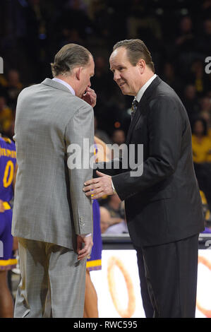 Wichita, Kansas, USA. 05th Mar, 2019. Wichita State Shockers head coach Gregg Marshall and East Carolina Pirates head coach Joe Dooley say a few words after East Carolina Pirates forward Seth LeDay (3) was taken to the locker room with a leg injury during the NCAA Basketball Game between the ECU Pirates and the Wichita State Shockers at Charles Koch Arena in Wichita, Kansas. Kendall Shaw/CSM/Alamy Live News Stock Photo