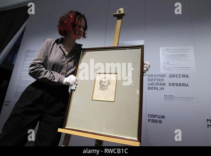 March 6, 2019 - Kiev, Ukraine - An employee sets the painting of self-portrait by Russian artist Kazimir Malevich, during the opening of the exhibition ''Avant-garde. In search of the fourth dimension'' in the center of modern art ''M17'' in Kiev, Ukraine, on 06 March 2019. According to representatives the M17, for the first time in Ukraine presented a previously unseen self-portrait by Russian artist Kazimir Malevich, which he painted 11 months before his death. ''Now i look like Marx in a grave. When I go out, the children shout Karl Marx,'' signed the author on a self-portrait, painted on 1 Stock Photo