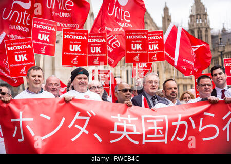 London, UK. 6th Mar, 2019. Workers from Honda's Swindon plant stage a demonstration outside the Houses of Parliament calling on MPs to save their factory from closing. Honda recently announced that the plant will cease production in 2022 amidst uncertainty over the future post-Brexit. Credit: Stephen Chung/Alamy Live News Stock Photo