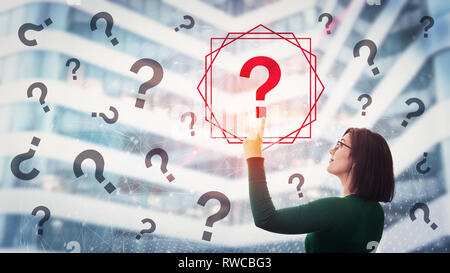 Woman pressing a screen interface selecting red interrogation mark from many different sign falling. Get answer to questions. Digital searching softwa Stock Photo