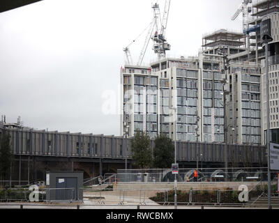 View from the bus station of new housing being built behind Westfield, White City Stock Photo