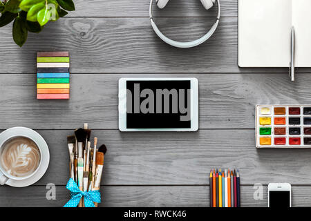 Digital tablet for creative education new app, school art supplies and graphic device empty blank mockup screen on grey wooden background, online teac Stock Photo