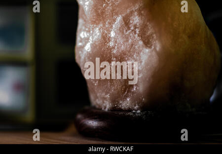Himalayan Salt Lamp on Wood Surface Stock Photo