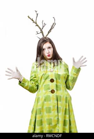 Funny mime performing and gesturing isolated on white background, a branch grows from his head. Stock Photo