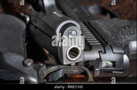 pistol laying on a table Stock Photo