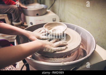 Potter working the mud with his hands Stock Photo - Alamy