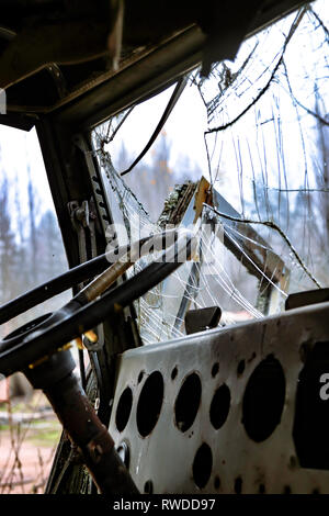 Vehicles left to decompose out the back of the police station inside the  Chernobyl exclusion zone Stock Photo