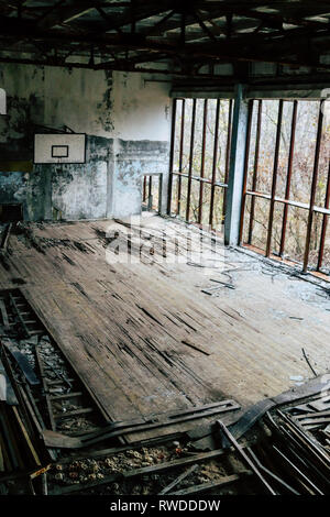 Abandoned basketball court left to rot with time inside Chernobyl's exclusion zone Stock Photo