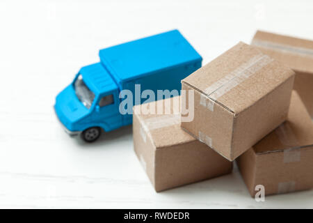 Delivery of goods from online stores. Day moving. Truck and cardboard boxes Stock Photo