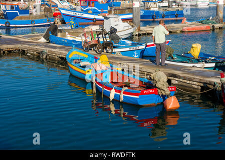 small colorful fishing boat in the port of Setubal, Portugal Stock Photo