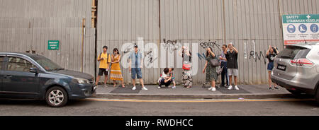Tourists taking photographs with their smartphones, Kuala Lumpur, Malaysia Stock Photo