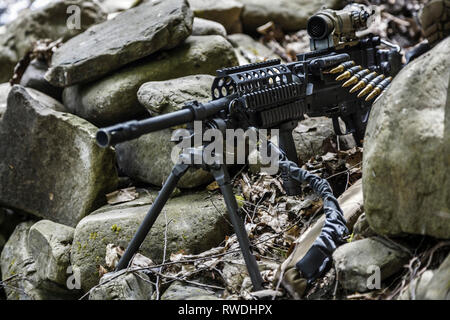 United States Army ranger machine gunner in the forest. Stock Photo