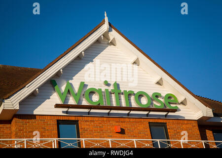 The Waitrose sign on the front of the Waitrose store in Henley-on-Thames, Oxfordshire. Stock Photo