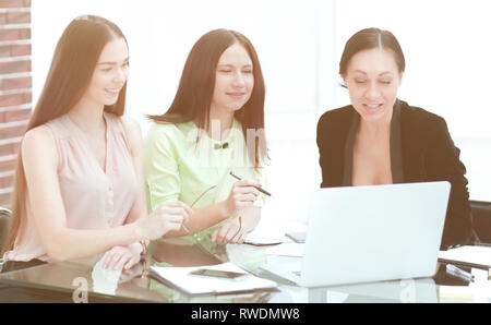 three business women working in a modern office Stock Photo