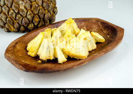 Edible part of marolo,  araticum or bruto fruit  on wooden bowl . Tropical  fruit of the original inhabitants of Brazil and Paraguai. Scientific name  Stock Photo