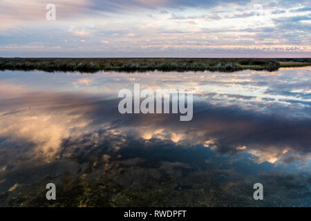Awesome sunset reflections on the Gulf Stock Photo