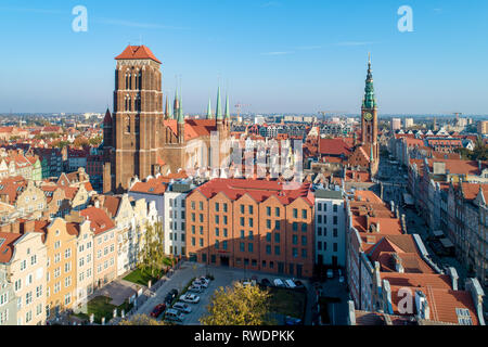 Gdansk, Poland. Old city with St Mary church, town hall tower, Dluga (Long) Street, and old historic houses.  Aerial view in sunset light