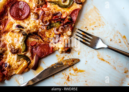 Half Eaten Pepperoni Pizza Stock Photo