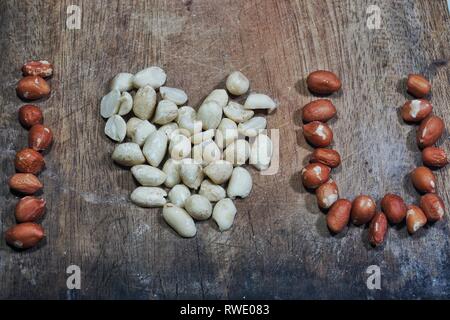 Sentences 'i love you' in roasted peanut formation on wooden background Stock Photo