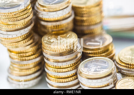 Towers with euro coins stacked together - close-up Stock Photo