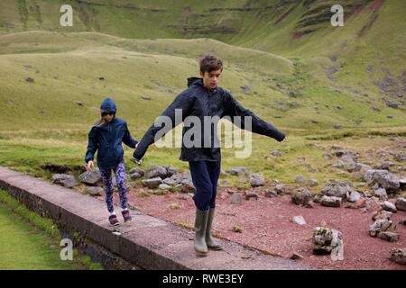 Kids Hiking in the Brecon Beacons National Park, Carmarthenshire, Wales Stock Photo