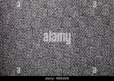 Knitted grey scarf texture background. Stock Photo