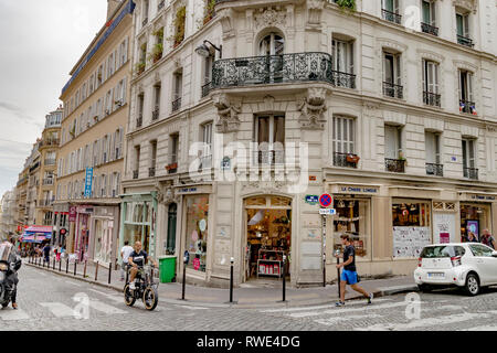 Rue des Martyrs,a long sloping street full of small shops and restaurants which cuts through the the 9th and 18th arrondissements of Paris Stock Photo