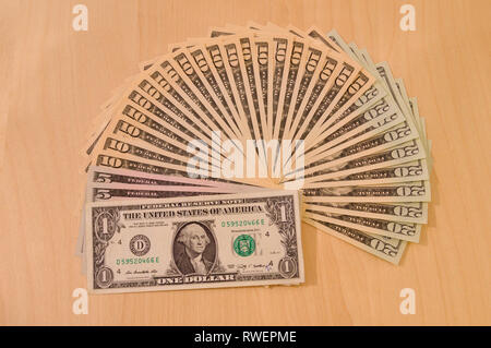A selection of US dollars on table - banknotes, cash, US dollars, dollars, bills Stock Photo