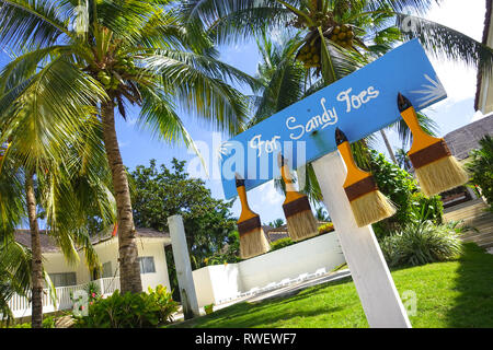 Sandy Toes Sign and Brushes at Tropical Beach Resort - Panglao - Bohol, Philippines Stock Photo