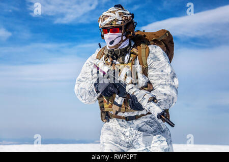 Army serviceman in winter camo somewhere in the Arctic. Stock Photo