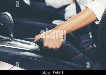 Asian women are the handbrake and Parking Brake car Stock Photo