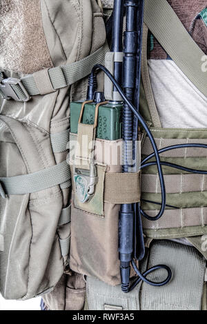 Close-up of an Army radio with folding antenna in the pouch. Stock Photo